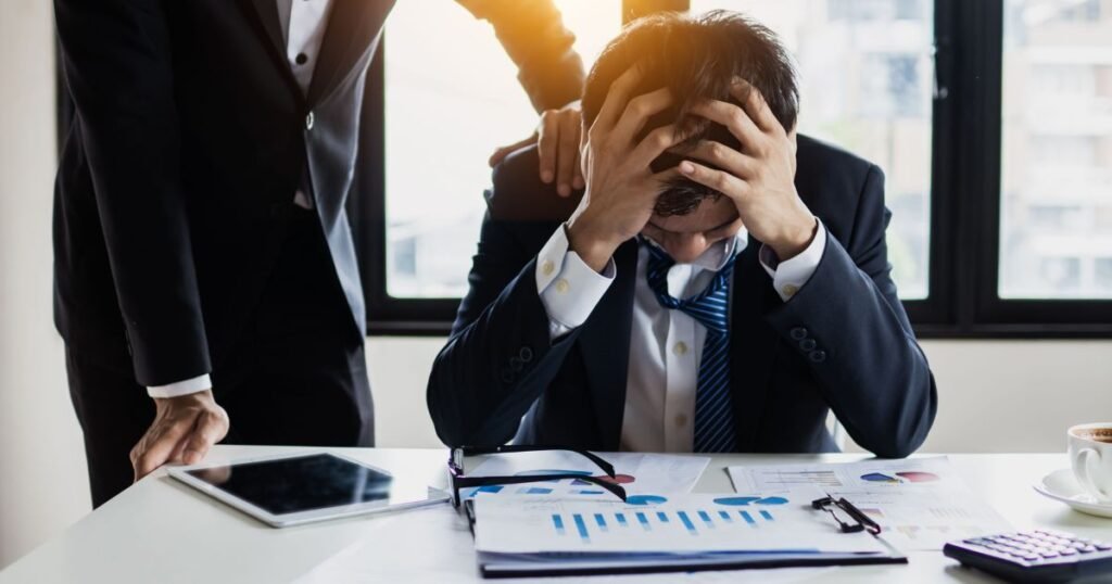 "Stressed office worker showing signs of stress affecting heart health and blood pressure."
