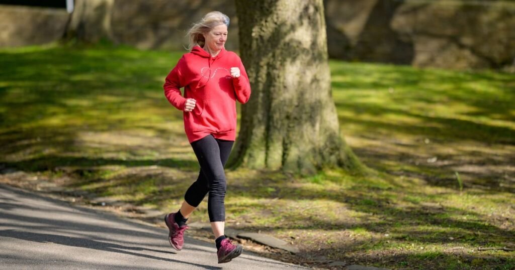 A woman is running on the road for morning walking